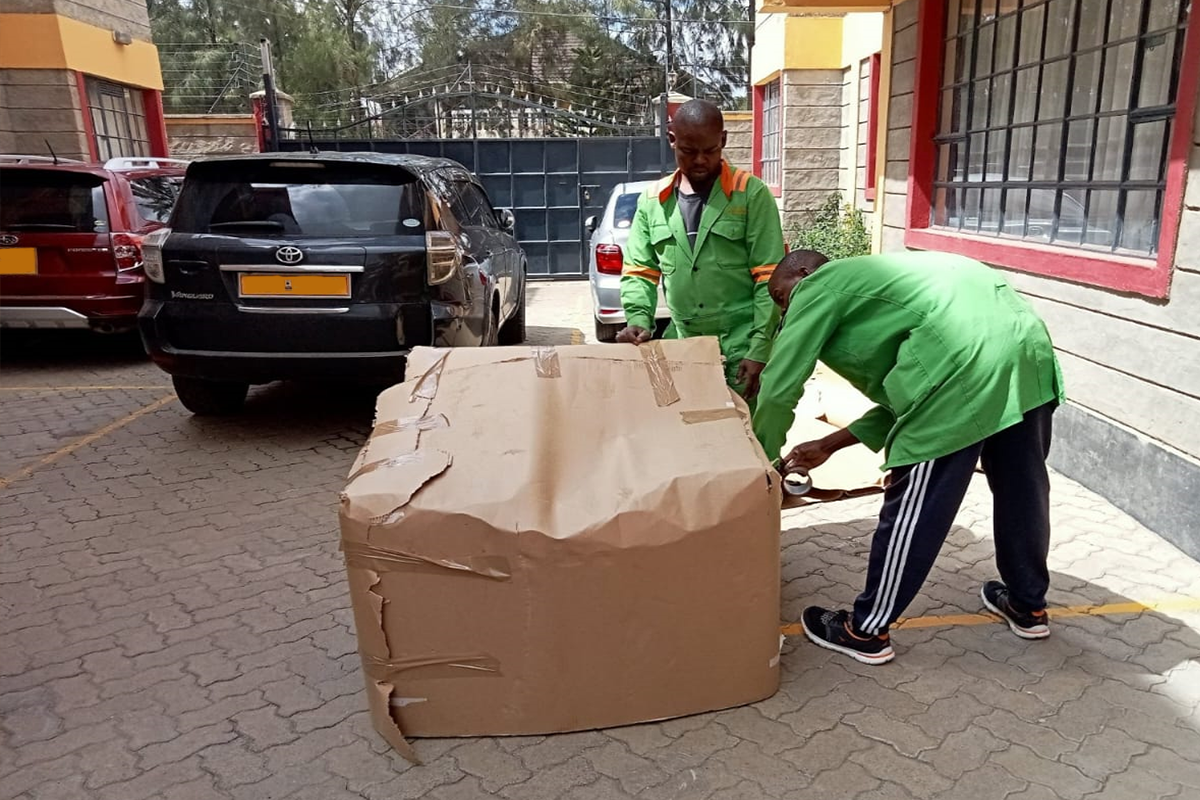 Professional movers wrapping items